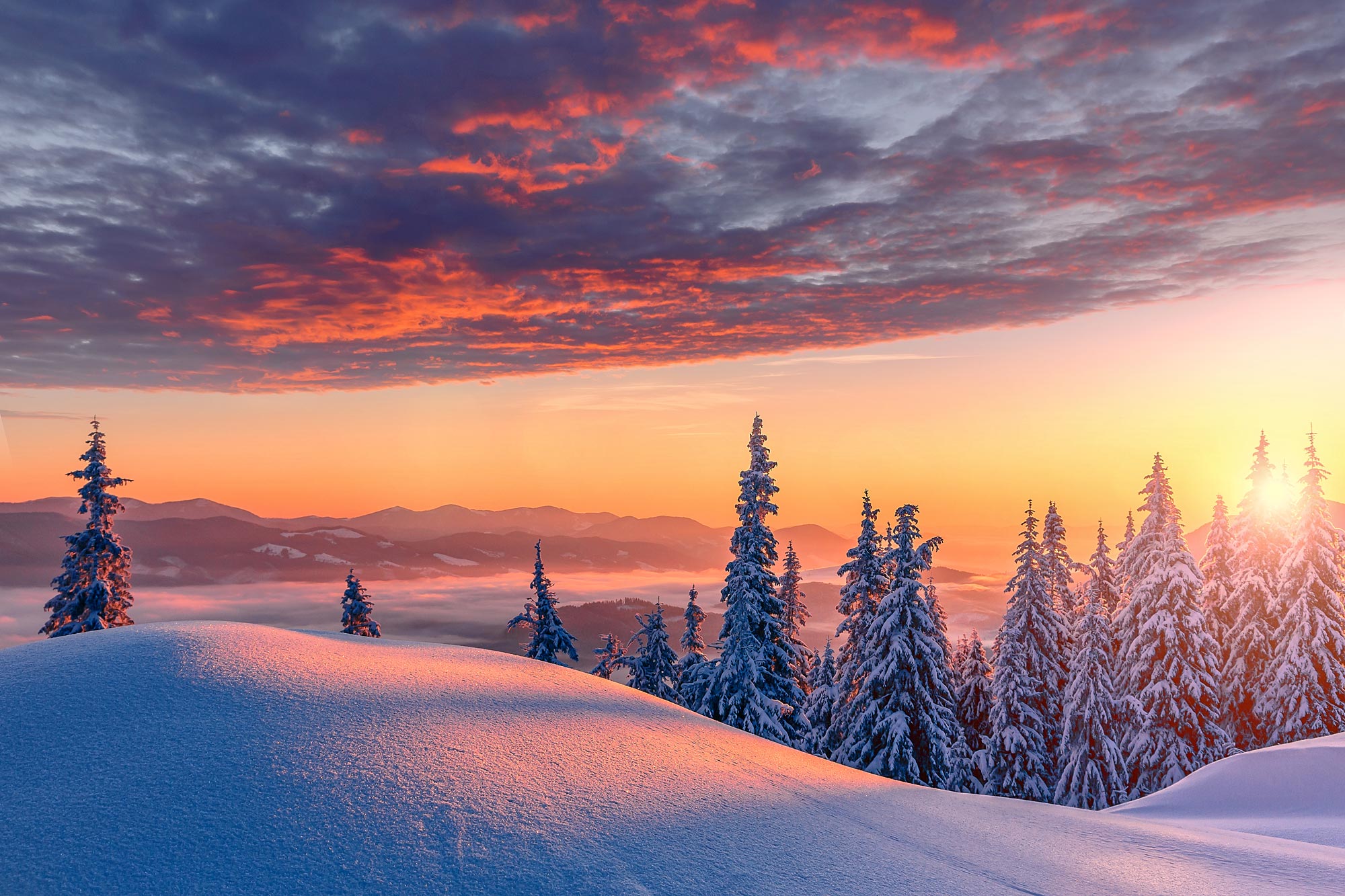 Sunset over a snowy vista