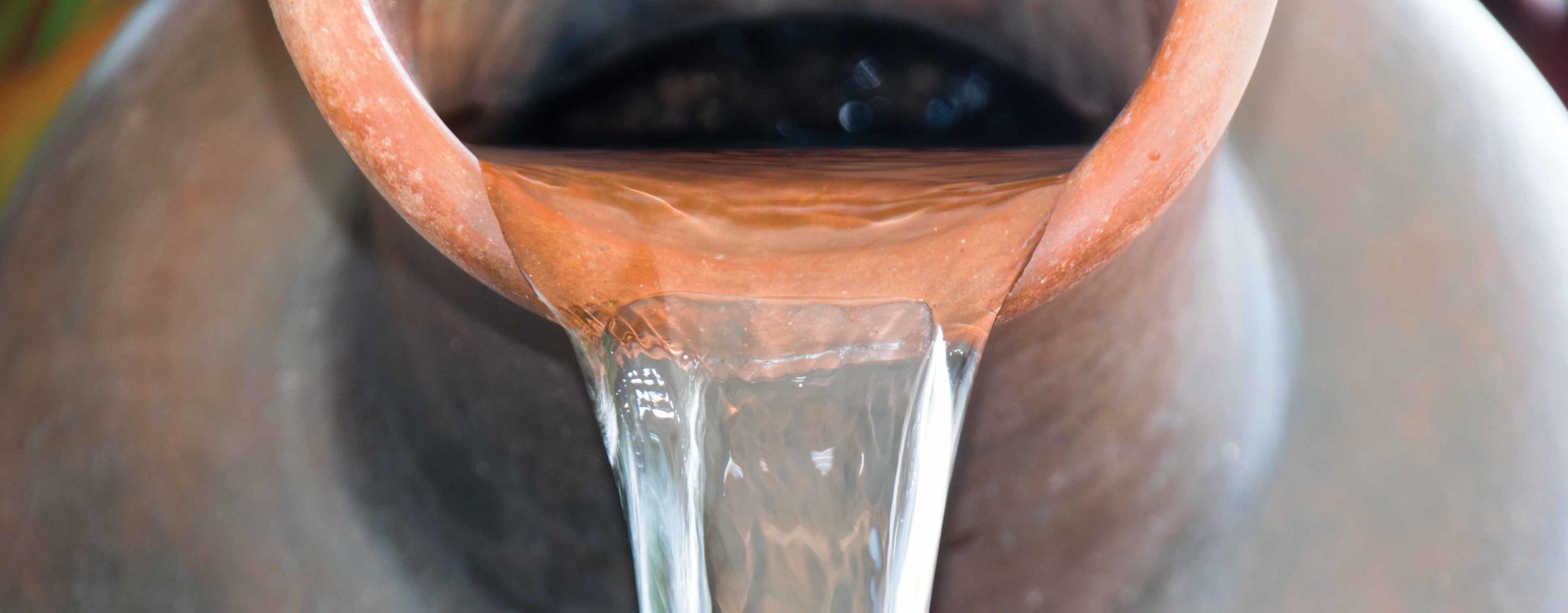 Water pours out of a jug